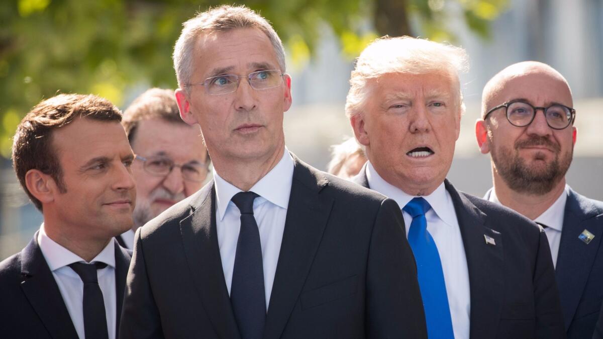 President Trump, seen with French President Emmanuel Macron, NATO Secretary General Jens Stoltenberg and Belgian Prime Minister Charles Michel, at NATO headquarters in Brussels on May 25.