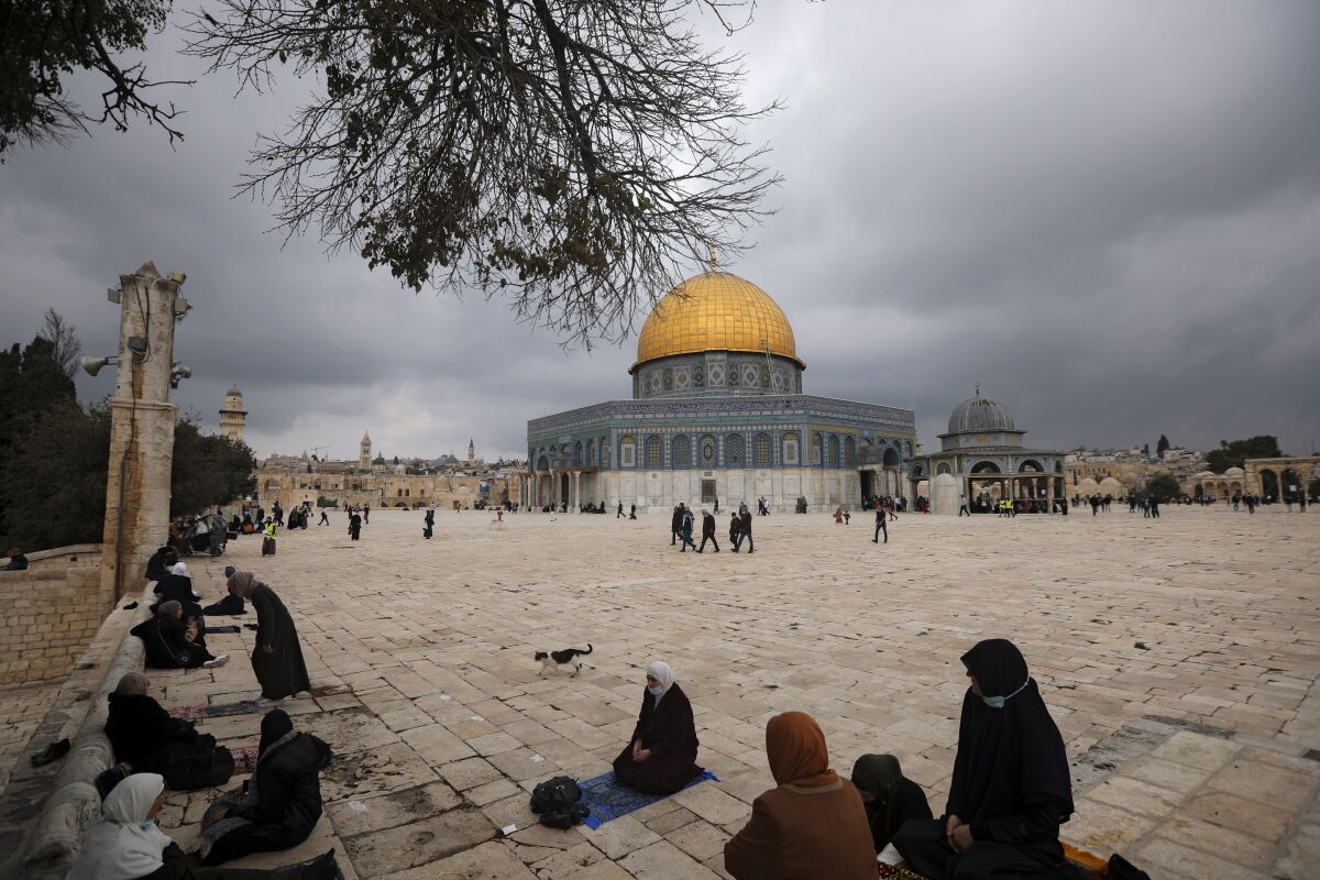 Muslims gather for Friday prayer, next to the Dome of the Rock Mosque in the Al Aqsa Mosque compound in Jerusalem's old city, Friday, Nov. 6, 2020. The Palestinian leadership has condemned the United Arab Emirates' decision to forge ties with Israel as a "betrayal," but it could lead to a tourism bonanza for Palestinians in east Jerusalem as Israel courts wealthy Gulf travelers. (AP Photo/Mahmoud Illean)
