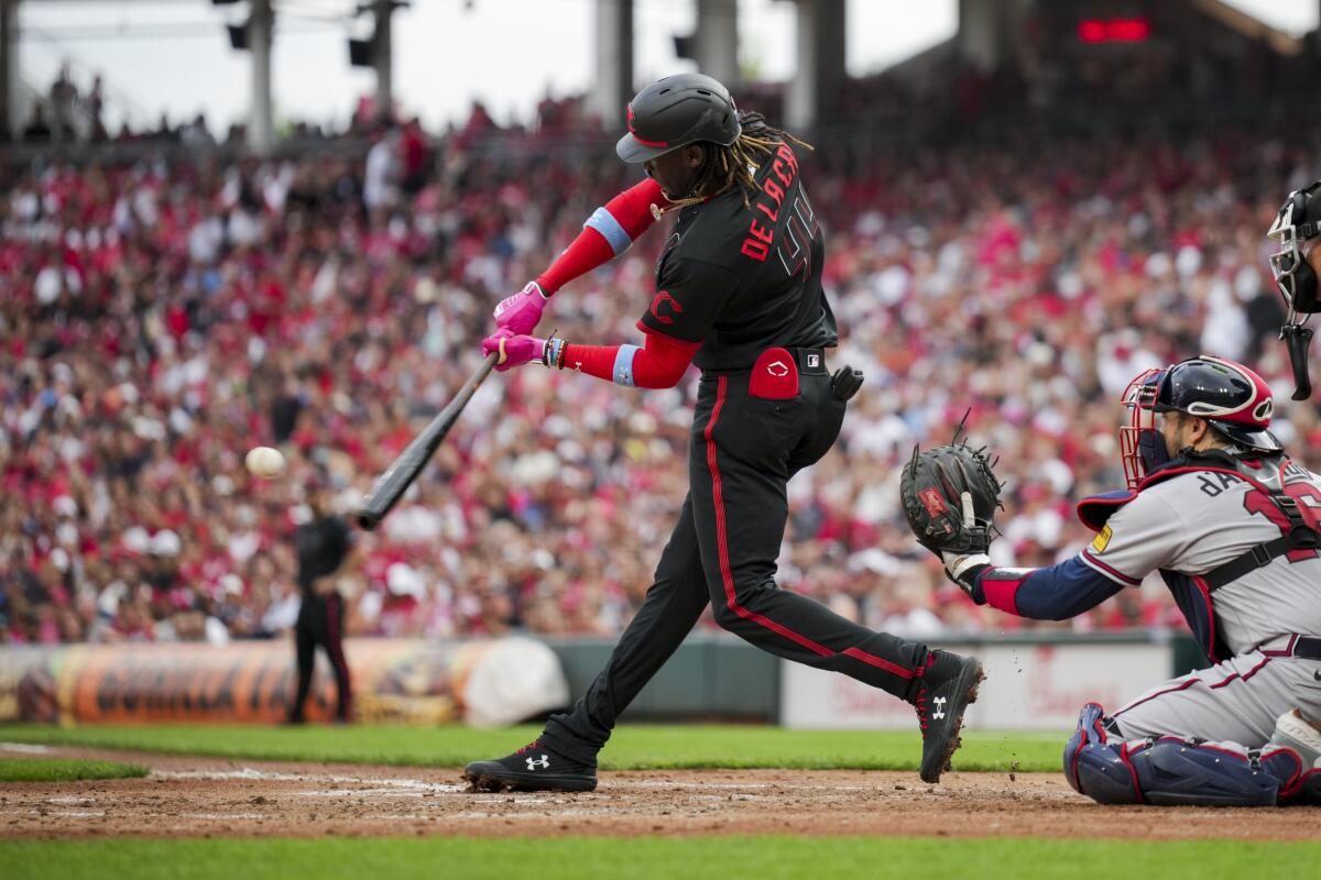 Cincinnati Reds' Elly De La Cruz hits a double during the second inning of a baseball game.