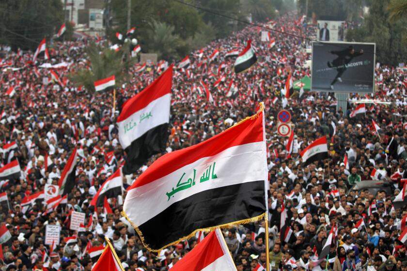 Supporters of Iraqi cleric Moqtada Sadr gather in Baghdad on Friday to demand an end to the presence of U.S. forces in their country.