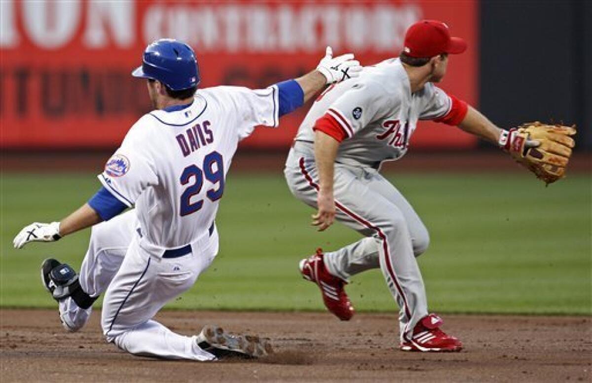 Philadelphia Phillies second baseman Chase Utley is congratulated