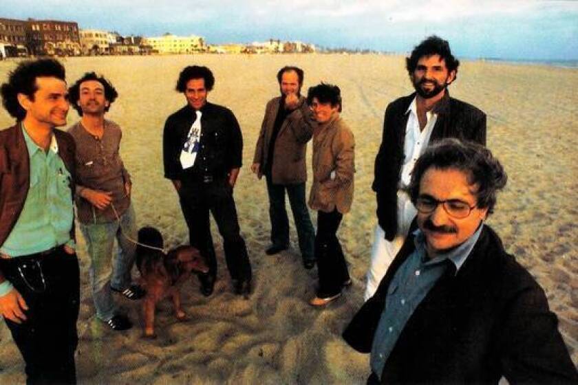 Seven of the architects who participated in the Architecture Gallery, from left: Frederick Fisher, Robert Mangurian, Eric Owen Moss, Coy Howard, Craig Hodgetts, Thom Mayne, and Frank Gehry at Venice Beach, 1980