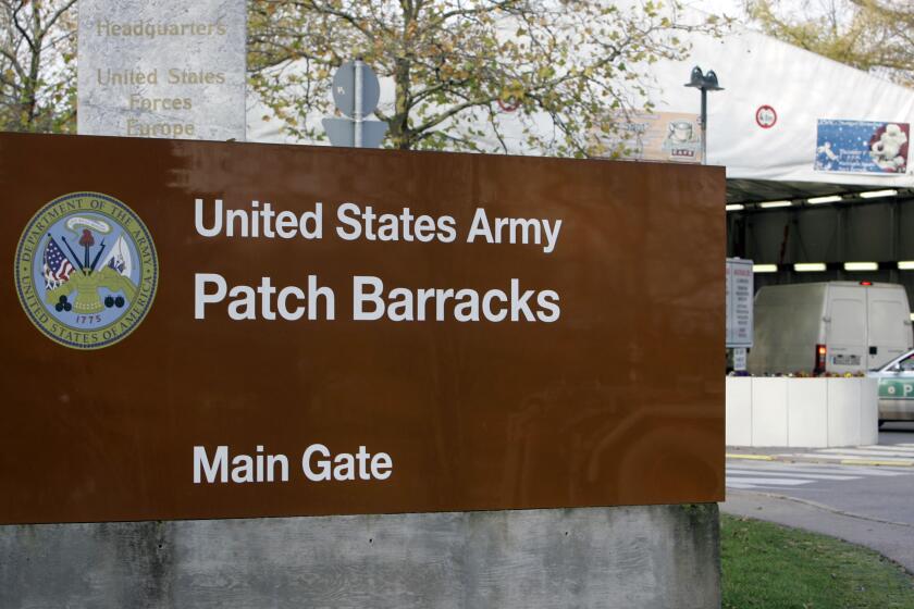 FILE - The main entrance for the U.S. Army Patch Barracks in Stuttgart, Germany, Nov. 28, 2006, where the headquarters of the U.S. European Command (EUCOM) is located. The U.S, military has raised the security protection measures it is taking at its bases throughout Europe, asking service members to be more vigilant and keep a lower profile due to a combination of threats it's seeing across the region. (AP Photo/Thomas Kienzle, File)