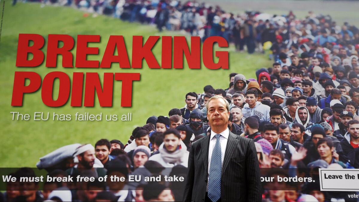 Right-wing parliament member Nigel Farage poses during the Brexit campaign in front of a poster depicting a crowd of refugees ostensibly headed for Britain. The poster was widely condemned.
