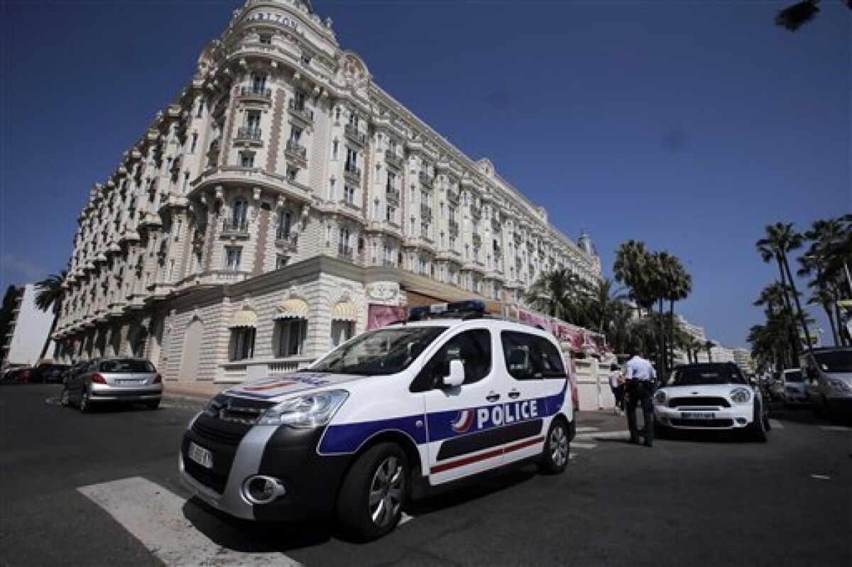 A view of the Carlton hotel, in Cannes, southern France, the scene of a daylight raid, Sunday, July 28, 2013. A staggering 40 million euro ($53 million) worth of jewels and diamonds were stolen Sunday from the Carlton Intercontinental Hotel in Cannes, in one of Europe's biggest jewelry heists recent years, police said. French Riviera hotel was hosting a temporary jewelry exhibit over the summer of the prestigious Leviev diamond house, which is owned by Israeli billionaire Lev Leviev. (AP Photo/L
