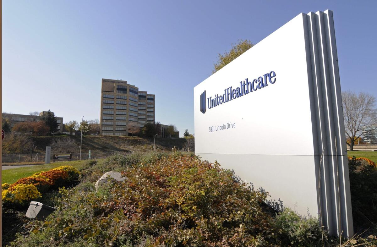 Health insurer UnitedHealth cut its earnings forecast, citing hits it expects to take from public insurance exchanges.