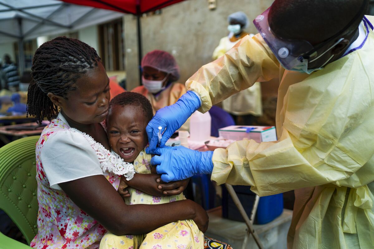FILE - A child is vaccinated against Ebola in Beni, Congo, July 13, 2019. Congolese officials Thursday Dec. 16, 2021 announced an end to an Ebola outbreak that had killed at least six people since October 2021 in the latest health challenge confronting the country's restive east.(AP Photo/Jerome Delay, file)