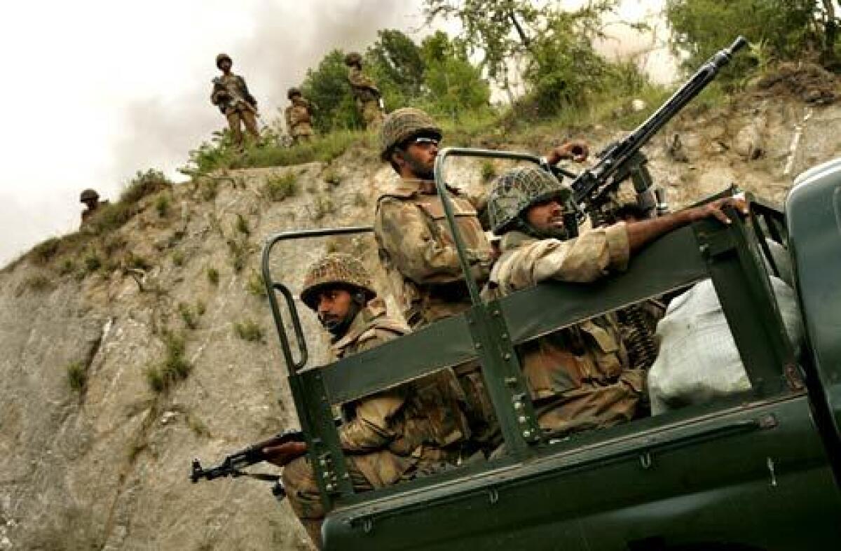 Pakistani soldiers take up positions on hilltops along the main road through Sakhra Valley. "We have very soft vehicles. This is one of our weaknesses, and any attack can cause casualties," says Brig. Suba Khan, in command of the operation in the valley. Two soldiers were killed the previous day when an improvised explosive device exploded along the same road. Audio slide show >>