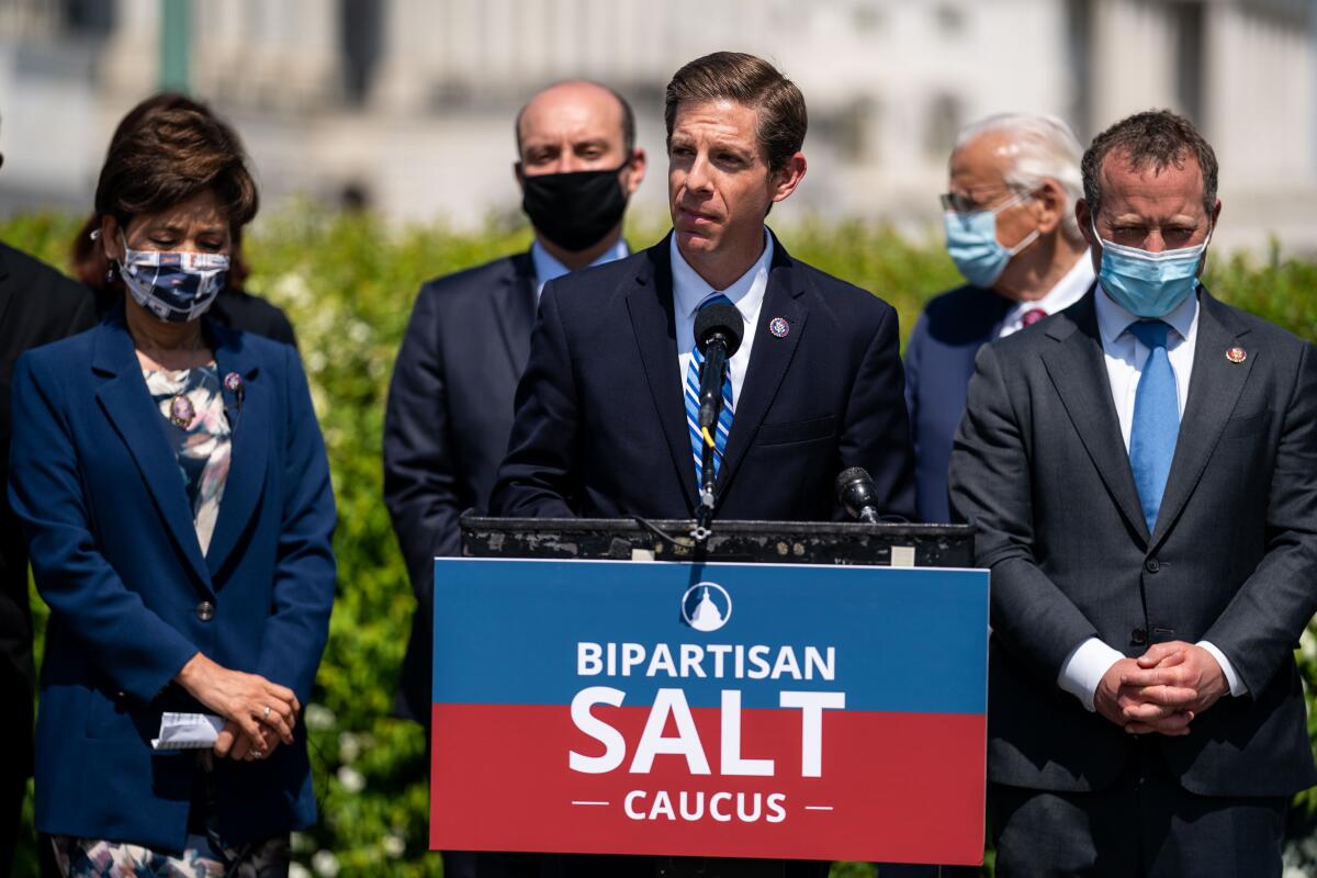 Rep. Mike Levin, center, at a news conference Washington, D.C.