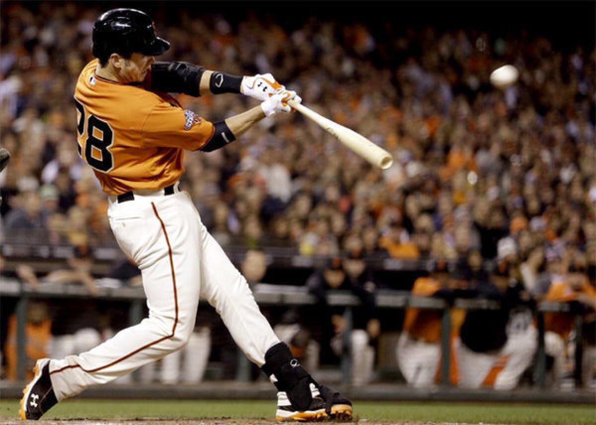 San Francisco Giants' Buster Posey hits an RBI double in the sixth inning.