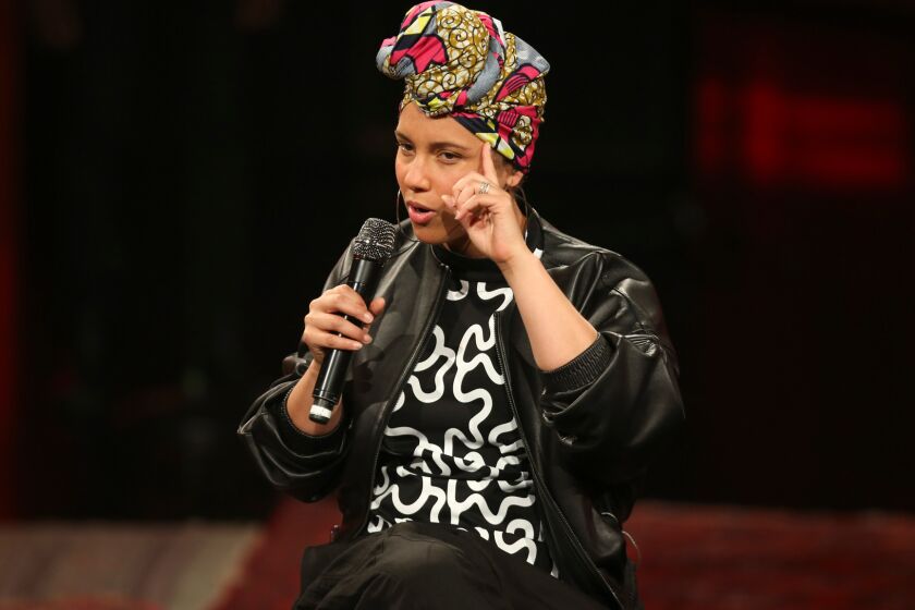 Alicia Keys, pictured in concert in Milan, Italy, wants fans to think about compulsive in-concert smartphone use.