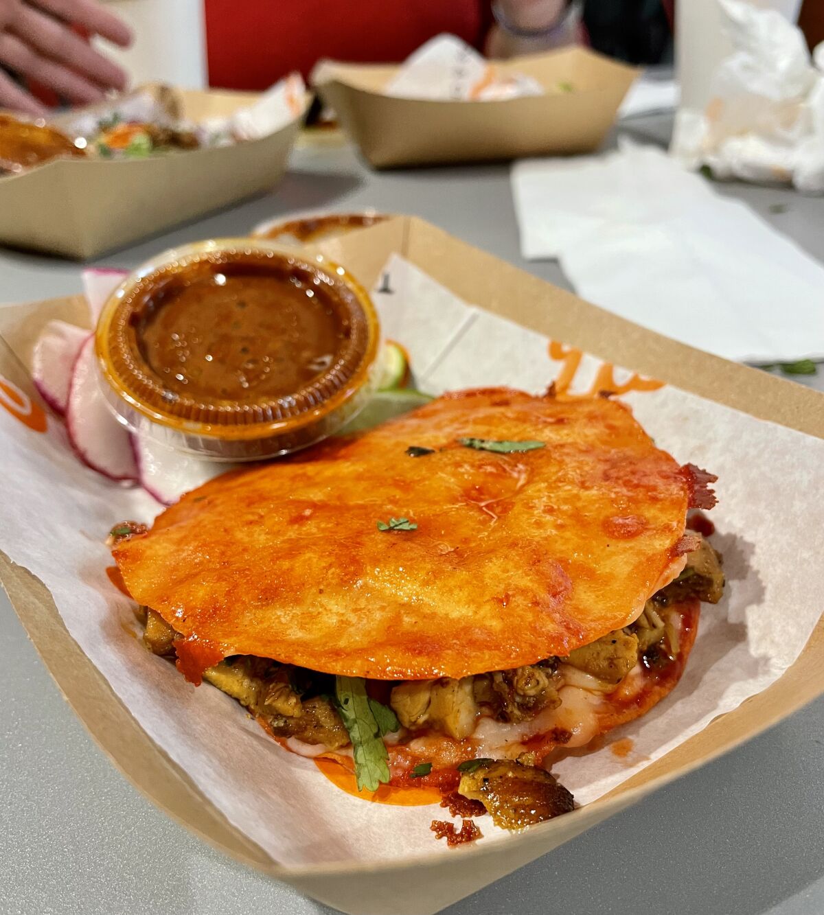 The mulita filled with beef birria at Papi Tacos & Churros in Santa Ana.