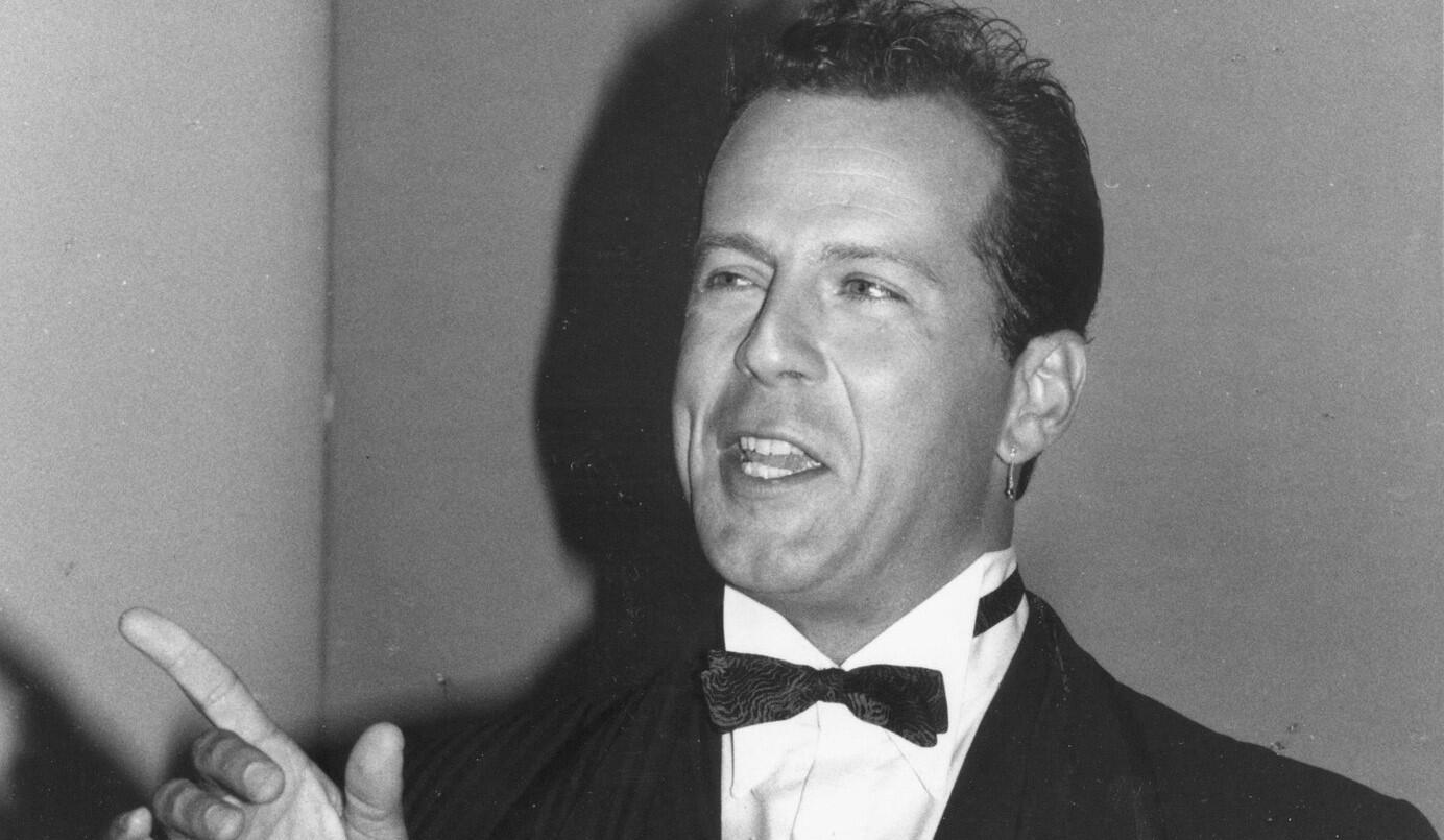 Actor Bruce Willis, whose lengthy career began in television, hosted the Emmys the same year he won this award. A 1987 file photo shows Willis, winner of lead actor in a drama series for his work in the detective series "Moonlighting," backstage.
