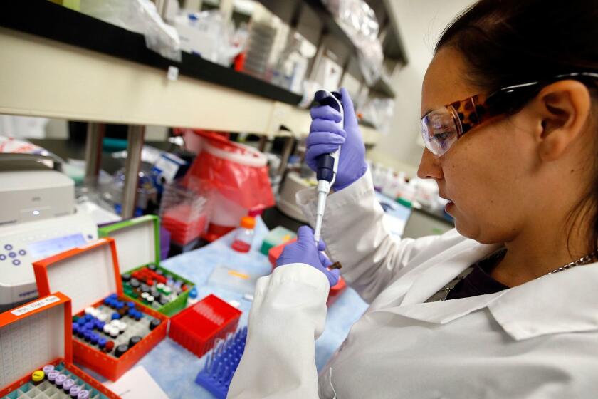 SANTA MONICA, CA SEPTEMBER 29, 2015 -- Stephanie Wiltzius, Associate Scientist at Kite Pharma setting up samples for an experiment at the Santa Monica facility that is testing a new treatment for blood cancer on September 29, 2015. (Al Seib / Los Angeles Times)