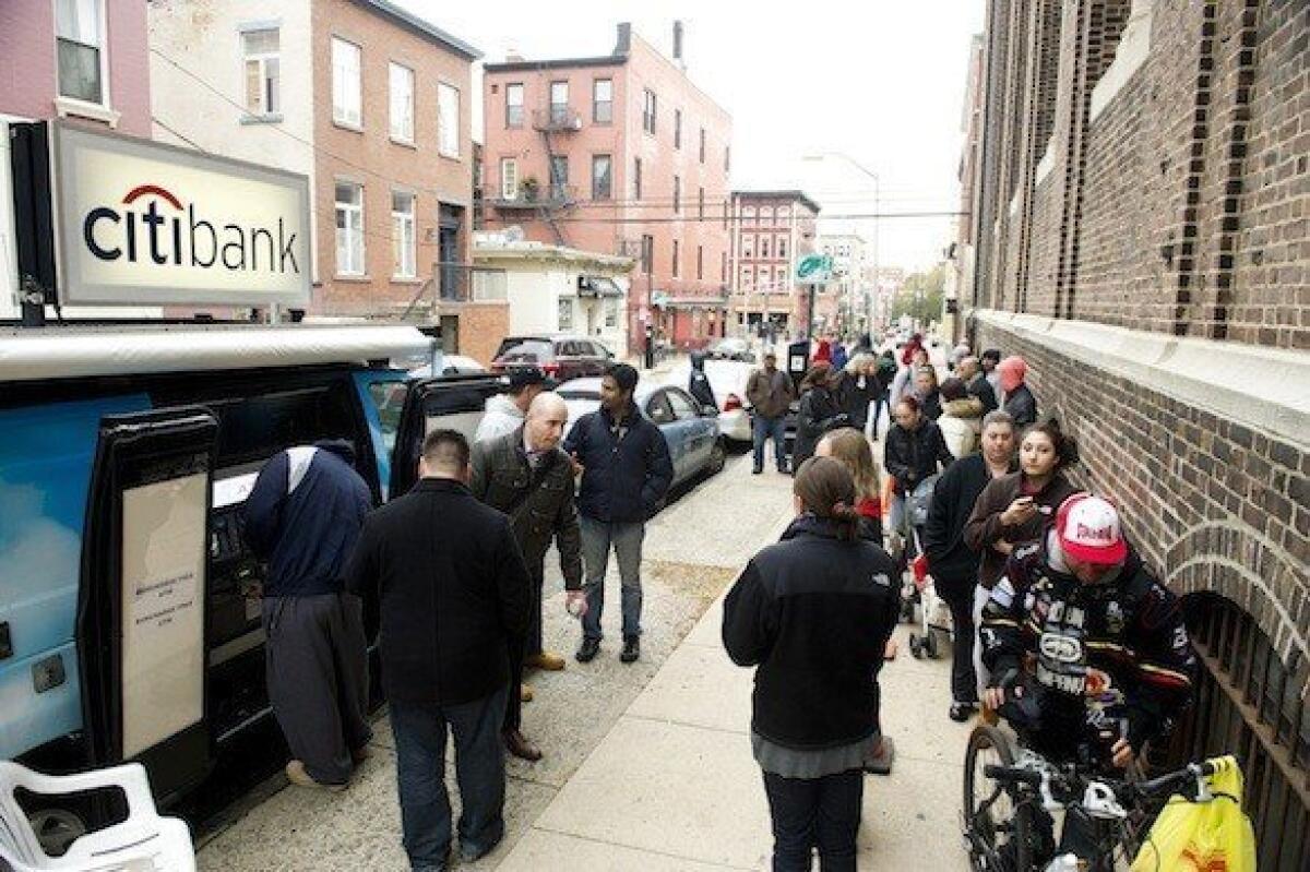 Citibank on Friday provided mobile fee-free ATM services to residents of Hoboken, N.J. The area was hard hit by Hurricane Sandy, and many residents were still without power.