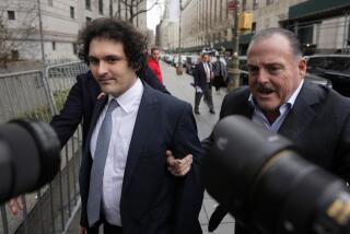 FTX founder Sam Bankman-Fried, left, arrives at Manhattan federal court, Thursday, Feb.16, 2023, in New York. The FTX founder returned to a New York courtroom for the second time in two weeks to explain why he keeps accessing parts of the internet that the government can't monitor and how it might affect his bail. (AP Photo/John Minchillo)