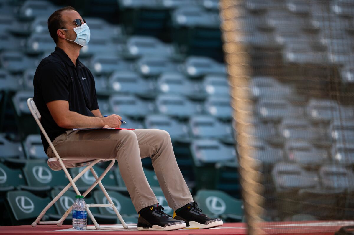 Angels general manager Billy Eppler watches an Angels intrasquad game at Angel Stadium in July 2020.
