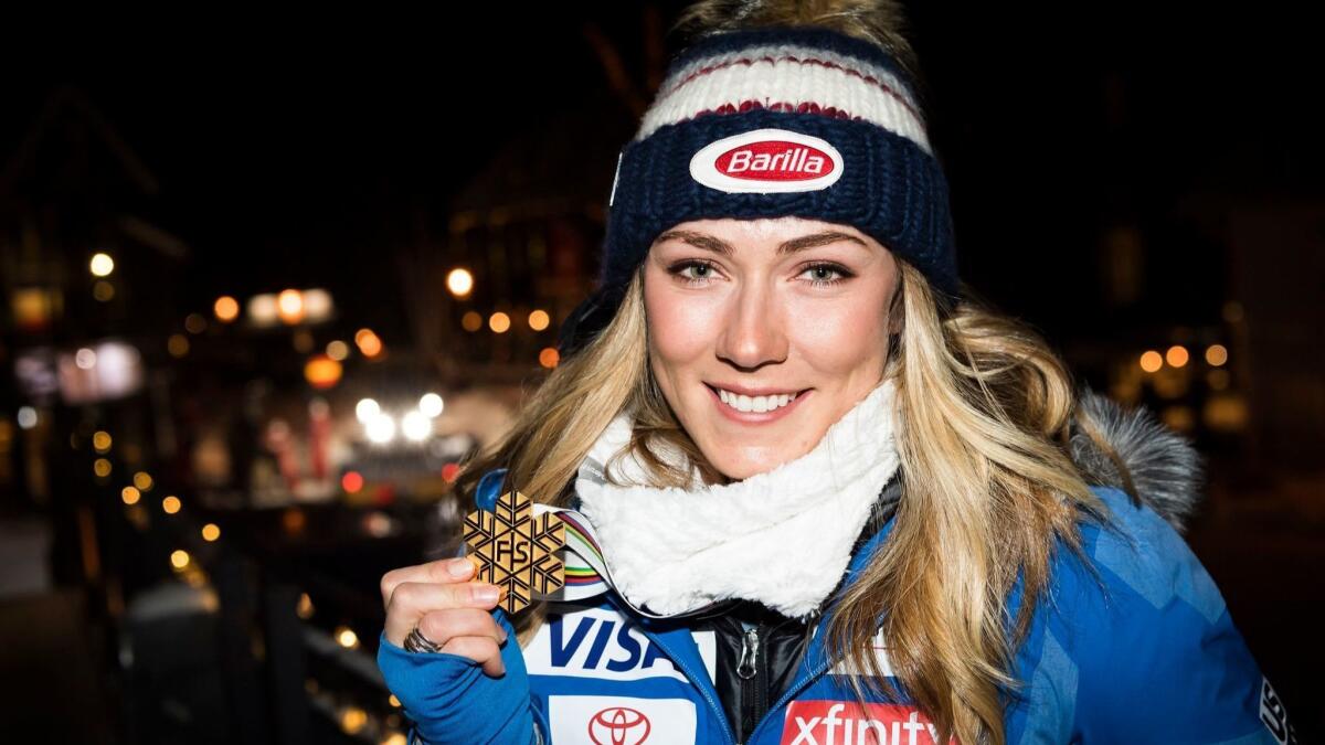 Mikaela Shiffrin poses for a photo after the medals ceremony for the super-G competition at the world championships.