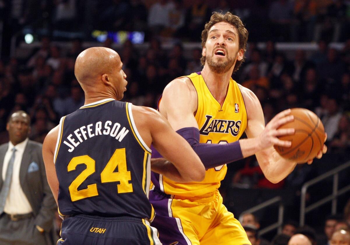 Lakers power forward Pau Gasol looks to score against Jazz forward Richard Jefferson in the first half Friday night at Staples Center.