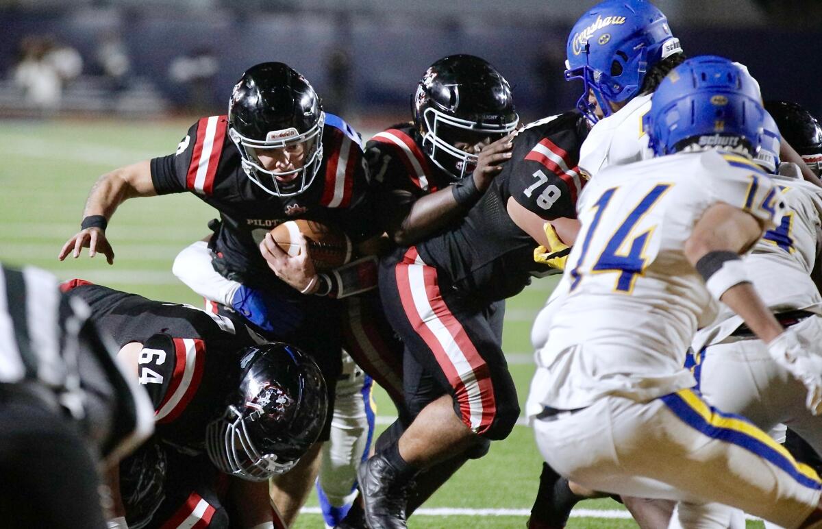 Banning High quarterback Robert Guerrero scores the winning touchdown against Crenshaw on a two-yard run.