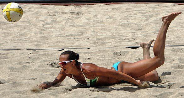 Angela Lewis goes for the dig Saturday during a three-game loss in a winner's bracket match of the AVP Long Beach Open. Nicole Branagh and Elaine Youngs defeated Lewis and her teammate, Priscilla Lima, 14-21, 21-13, 15-13.