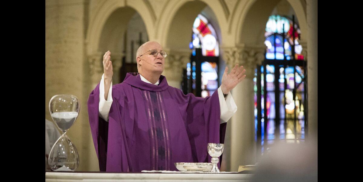 The Rev. Patrick J. Mulcahy leads an Ash Wednesday Mass at St. Joseph's Cathedral in downtown San Diego.