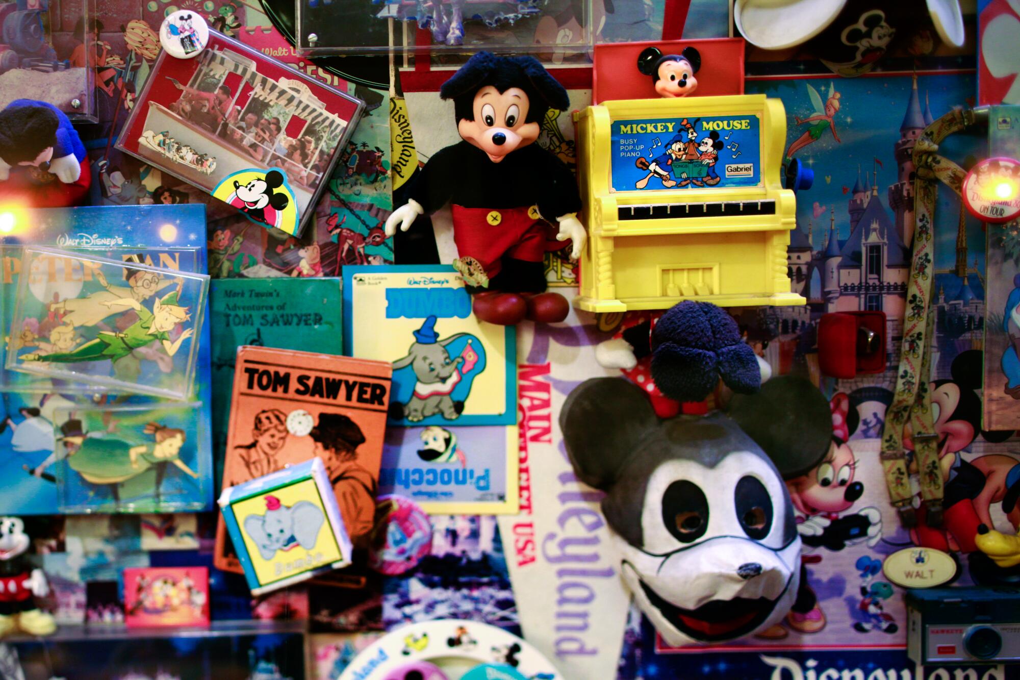 Souvenirs bear images of Mickey Mouse, Dumbo, Peter Pan, Tom Sawyer and others.
