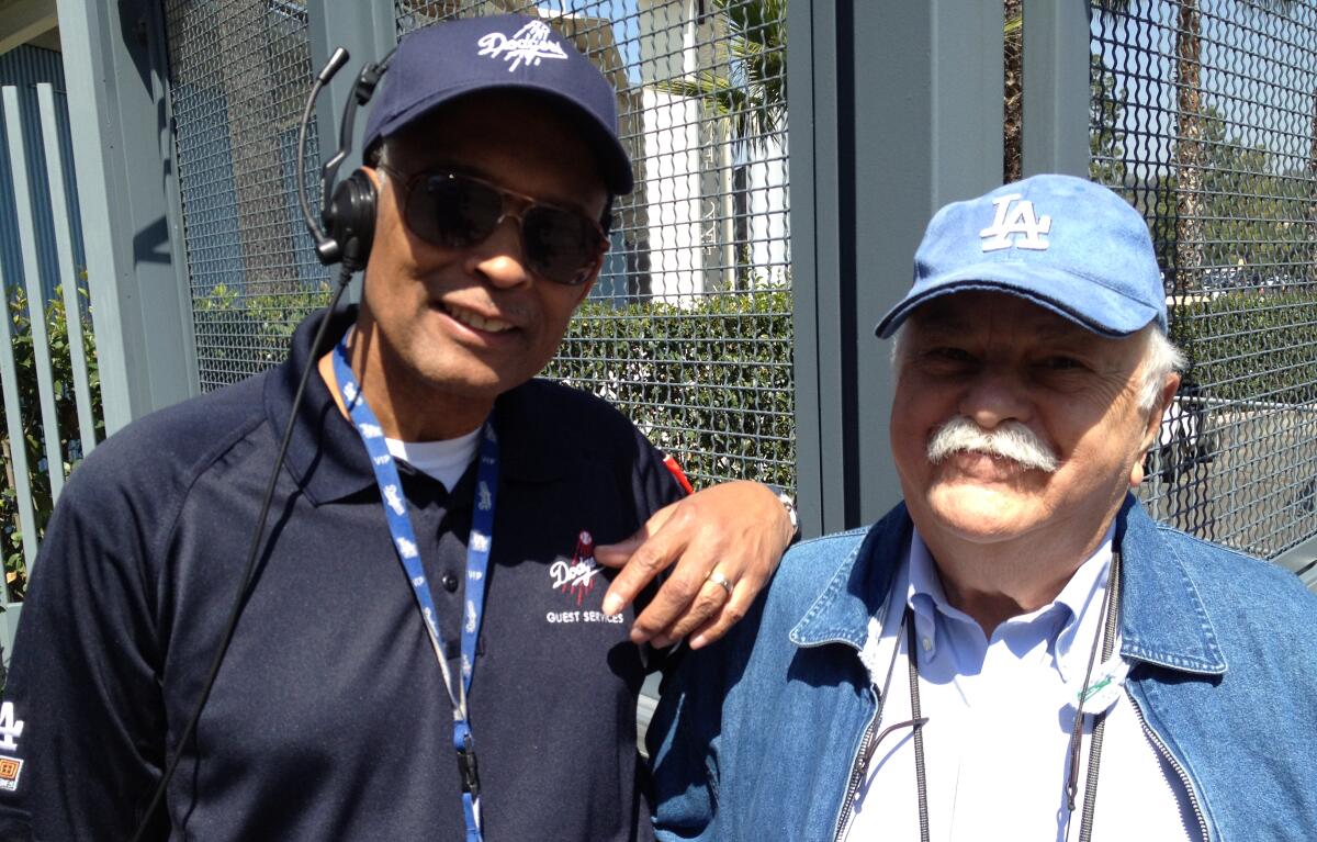 Dodger Stadium worker Errol Coffey and Dodgers fan Philip Brooks in 2012