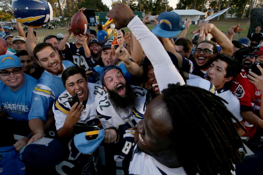 Chargers defensive end Melvin Ingram mingles with fans following the joint practice.