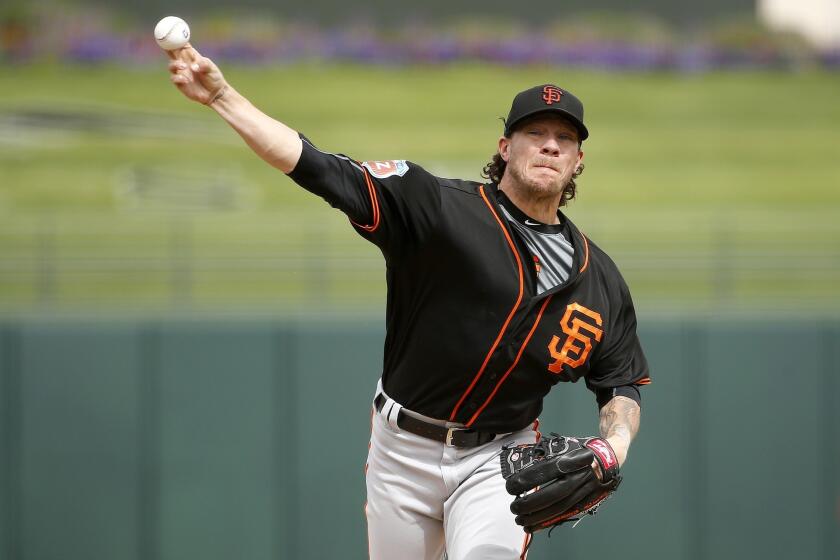 Giants starter Jake Peavy pitches against the Texas Rangers during the second inning of a spring training game on March 7.