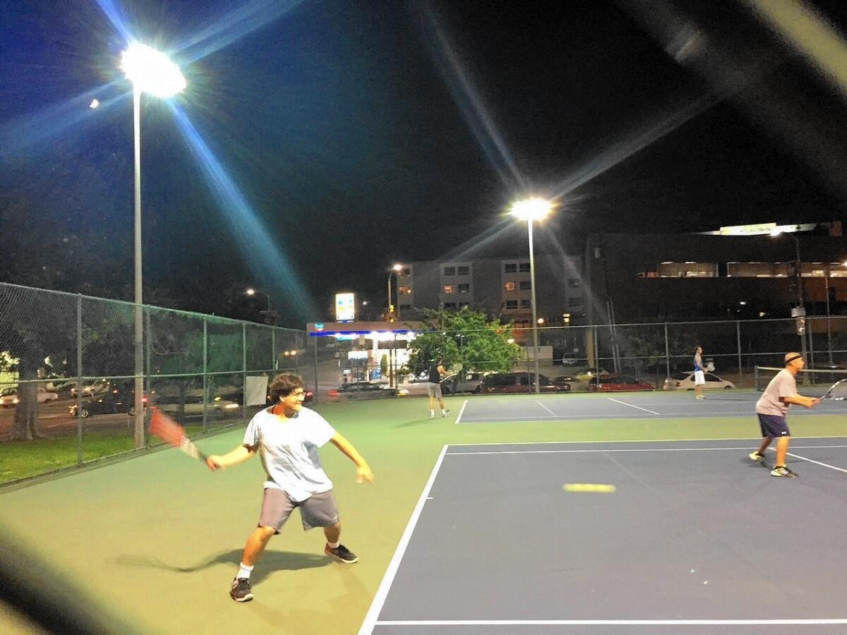 The tennis courts at Temple Street and Glendale Boulevard are often packed as late as midnight, mostly with men playing doubles.