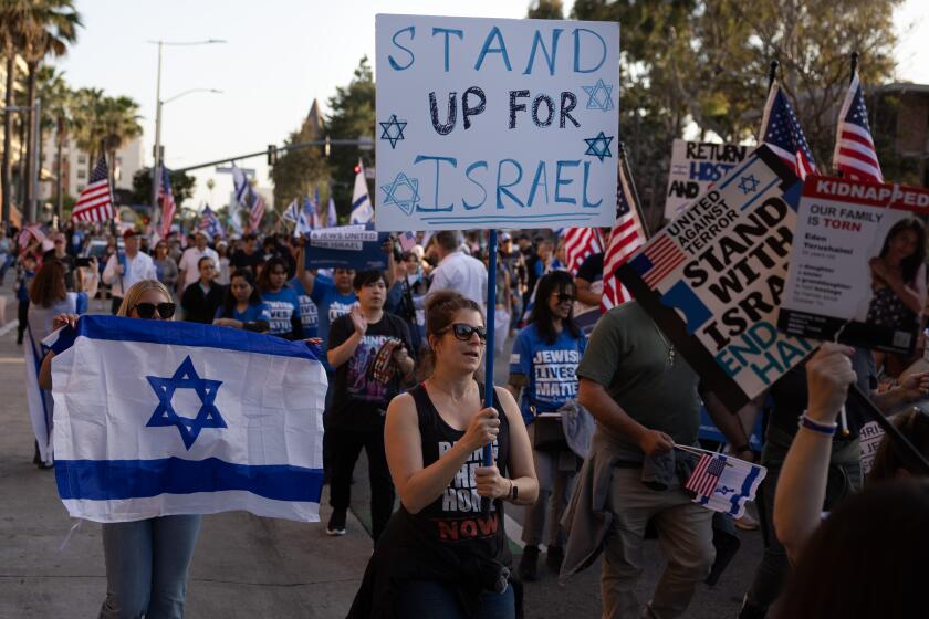 Los Angeles, CA - May 08: Pro-israeli supporters march at the “United for Israel" rally at the University of Southern California on Wednesday, May 8, 2024 in Los Angeles, CA. (Jason Armond / Los Angeles Times)