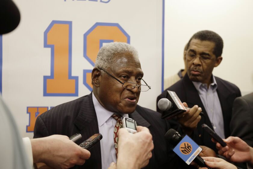 FILE - New York Knicks Hall-of-Famer Willis Reed responds to questions during an interview before an NBA basketball game between the Knicks and the Milwaukee Bucks, Friday, April 5, 2013, in New York. Willis Reed, who dramatically emerged from the locker room minutes before Game 7 of the 1970 NBA Finals to spark the New York Knicks to their first championship and create one of sports’ most enduring examples of playing through pain, died Tuesday, March 21, 2023. He was 80. Reed's death was announced by the National Basketball Retired Players Association, which confirmed it through his family. (AP Photo/Frank Franklin II, File)