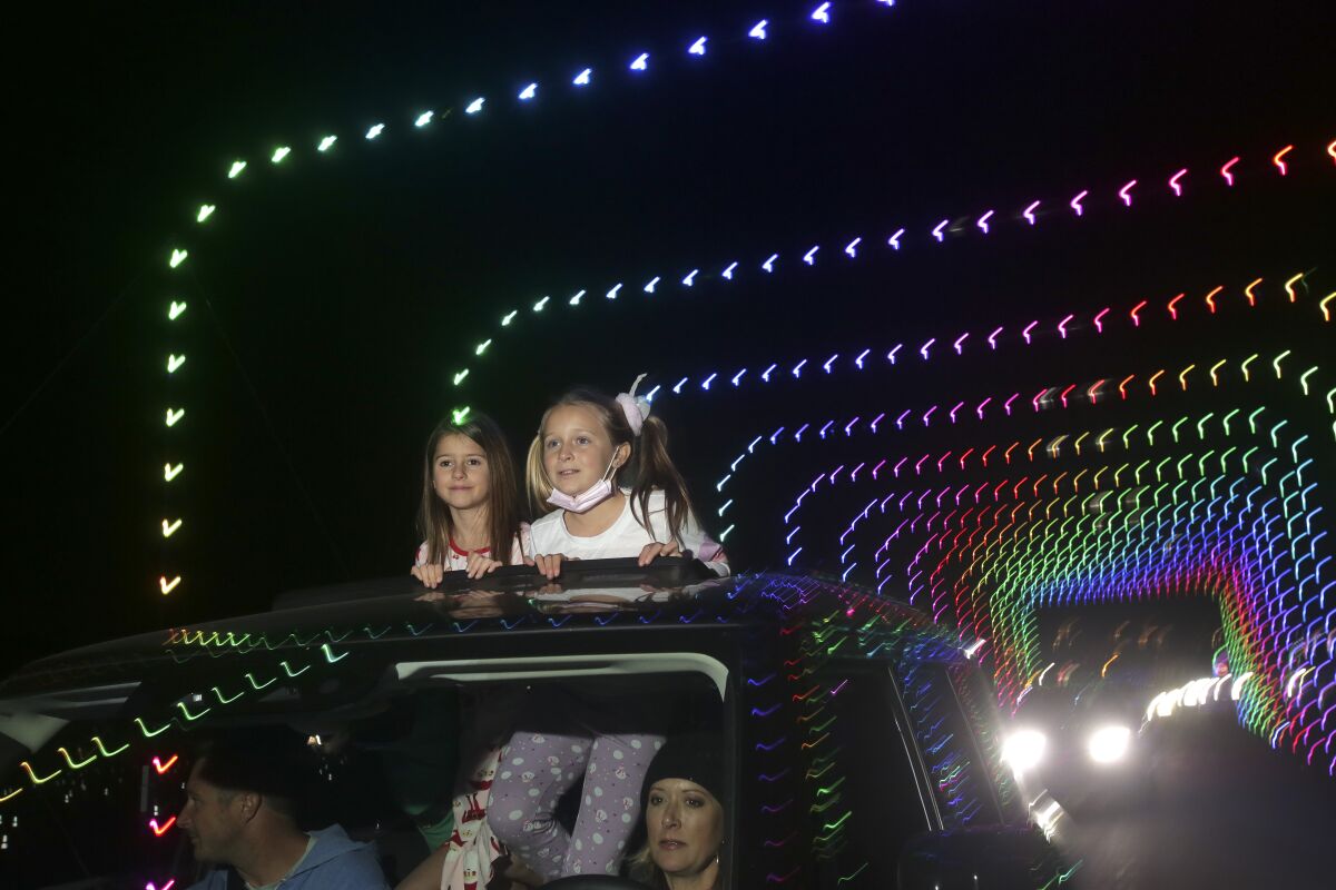 Taya Branwell, 9, right, and Gracie Vandenburg, 9,  at the 2020 Holidays In Your Car at Del Mar Fairgrounds