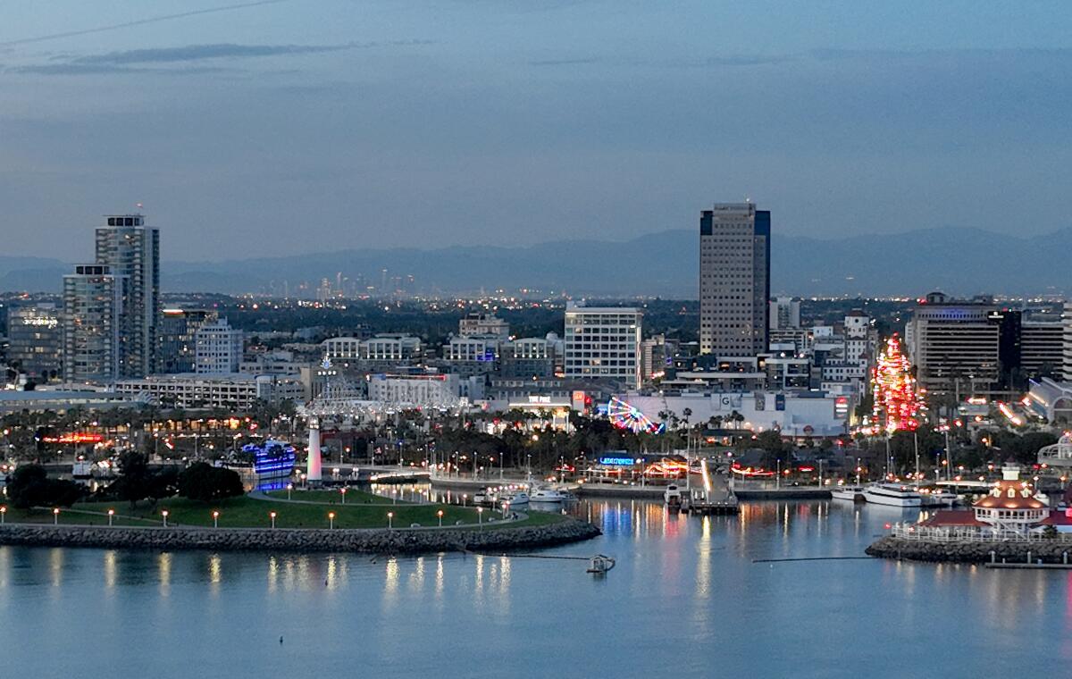 An aerial view of the Lion Lighthouse, Shoreline Aquatic Park, downtown Long Beach and Rainbow Harbor.