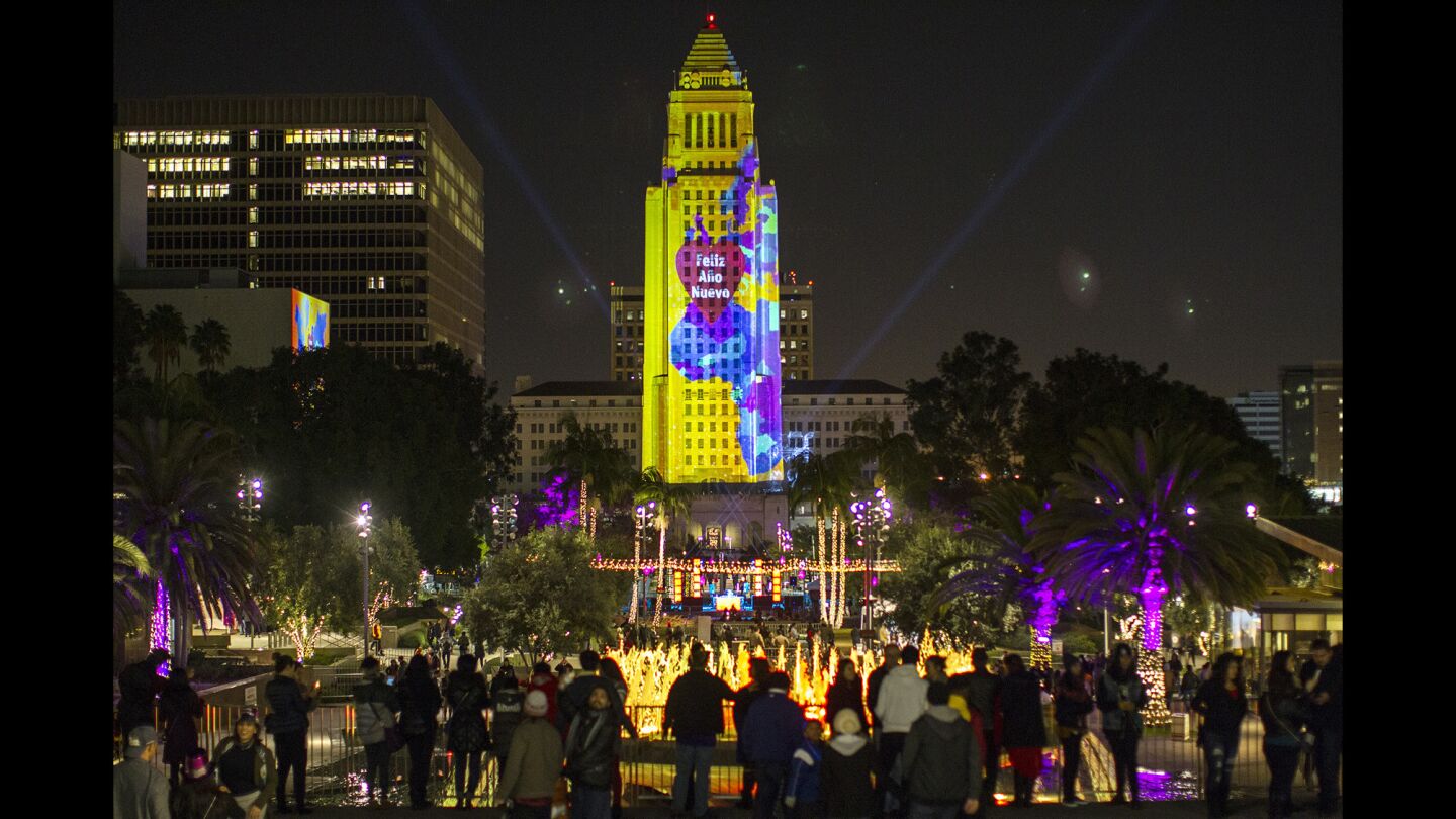 LOS ANGELES, CA - DECEMBER 31, 2015: City Hall is lit up with a 3D projection during New Year's Eve celebration at Grand Park on December 31, 2015 in Los Angeles, California.(Gina Ferazzi / Los Angeles Times)