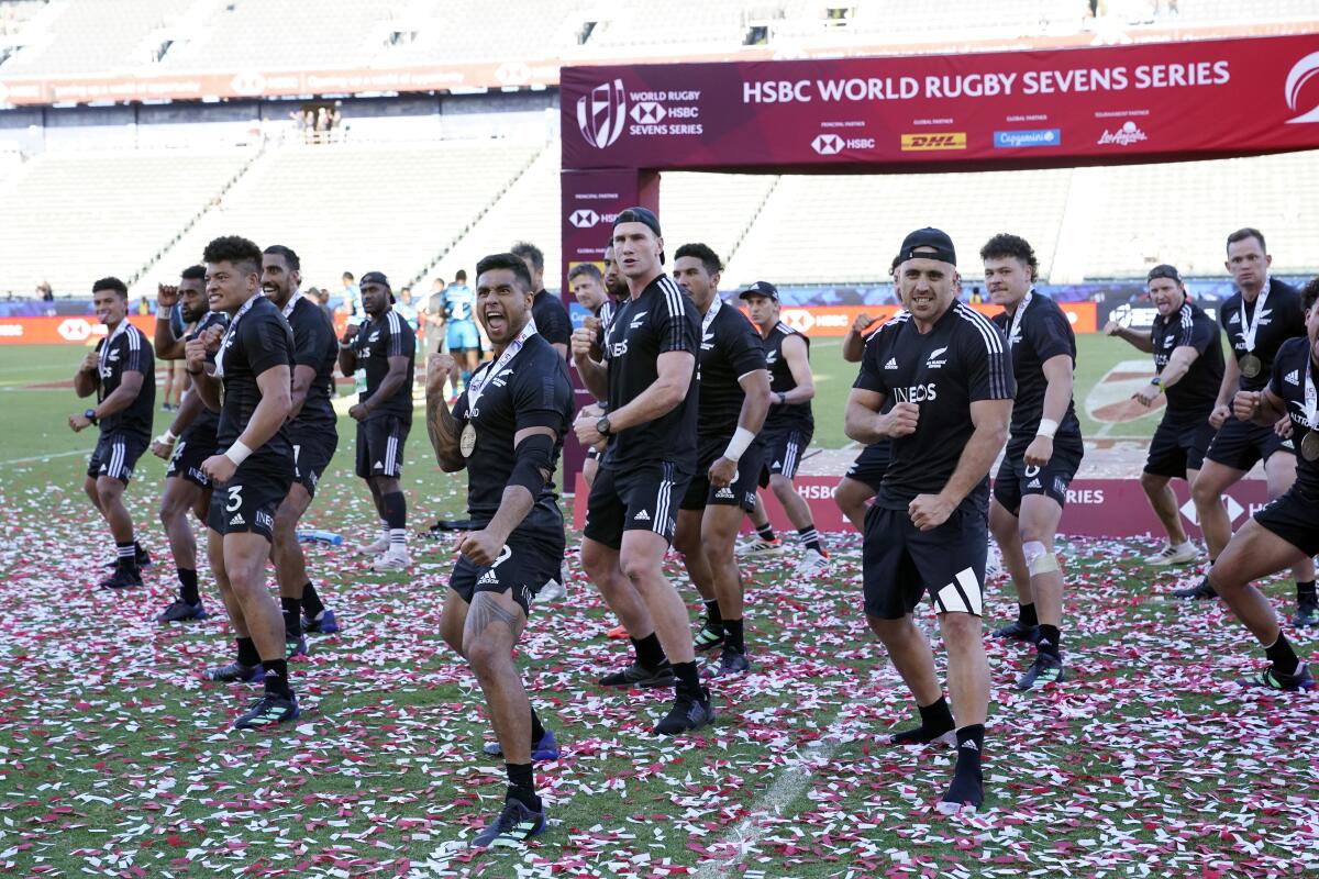 New Zealand celebrates with a ceremonial Haka dance after defeating Fiji on Sunday.