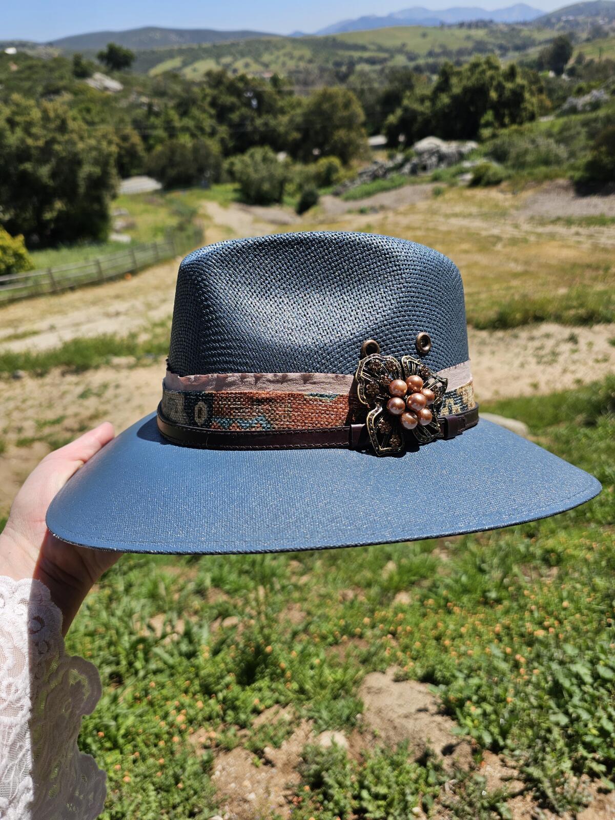 This blue hat brooch was picked up by Terry Kearns, co-owner of Ramona Ranch Winery, at a flea market in France.  