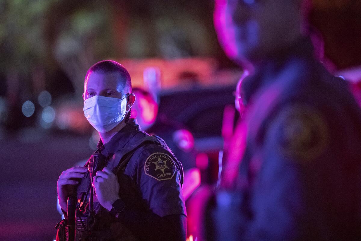 An Orange County sheriff's deputy wearing a face mask 