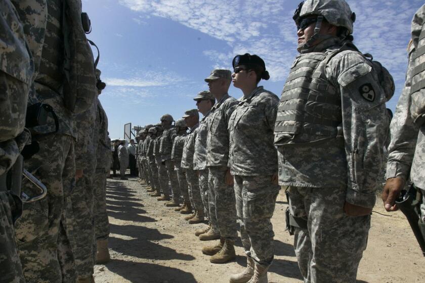 FILE - This Aug. 18, 2010, file photo shows California National Guard troops, who are part of Task Force Sierra, deployed at the border along with Border Patrol Agents near the California/Mexico border in San Diego. California Gov. Jerry Brown on Friday, Sept. 28, 2018, extended the state National Guard's participation in President Donald Trump's border deployment by six months, a low-key announcement that was made without any of the acrimony that characterized his early negotiations with the federal government. The California National Guard said in a press release that the mission will now run until the end of March 2019. (John Gibbins/The San Diego Union-Tribune via AP, File)