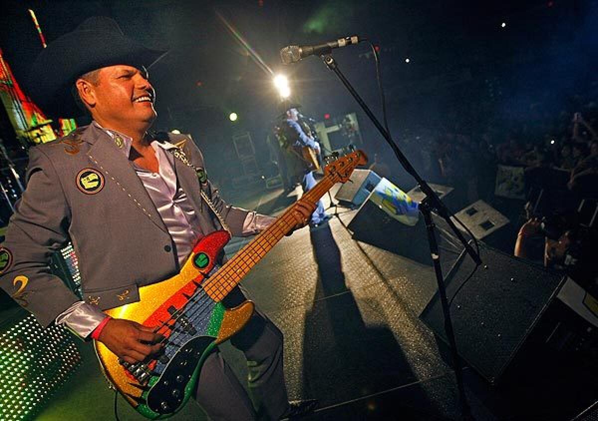 Mario Moreno Quintero, electric bass player for Los Tucanes de Tijuana, smiles at fans during a concert in San Diego. Police have forbidden the band to play in Tijuana, alleging that its songs glorify drug kingpins.