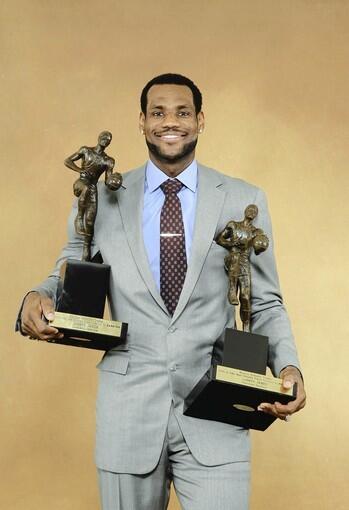 LeBron James receives the Maurice Podoloff Trophy as the 2009-10 NBA Most Valuable Player.