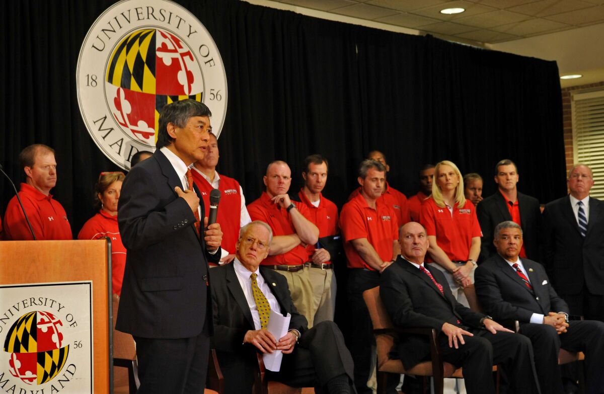 University of Maryland President Wallace Loh, left, in 2012. On Wednesday, he said a school computer database containing names and Social Security numbers had been hacked.