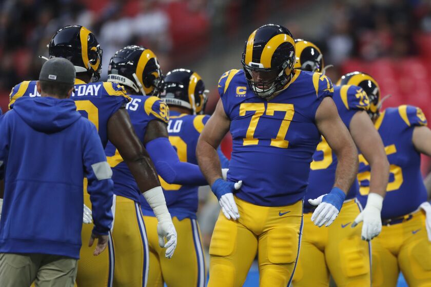Rams offensive tackle Andrew Whitworth (77) warms up with teammates before playing against the Bengals, his former team, for the first time.