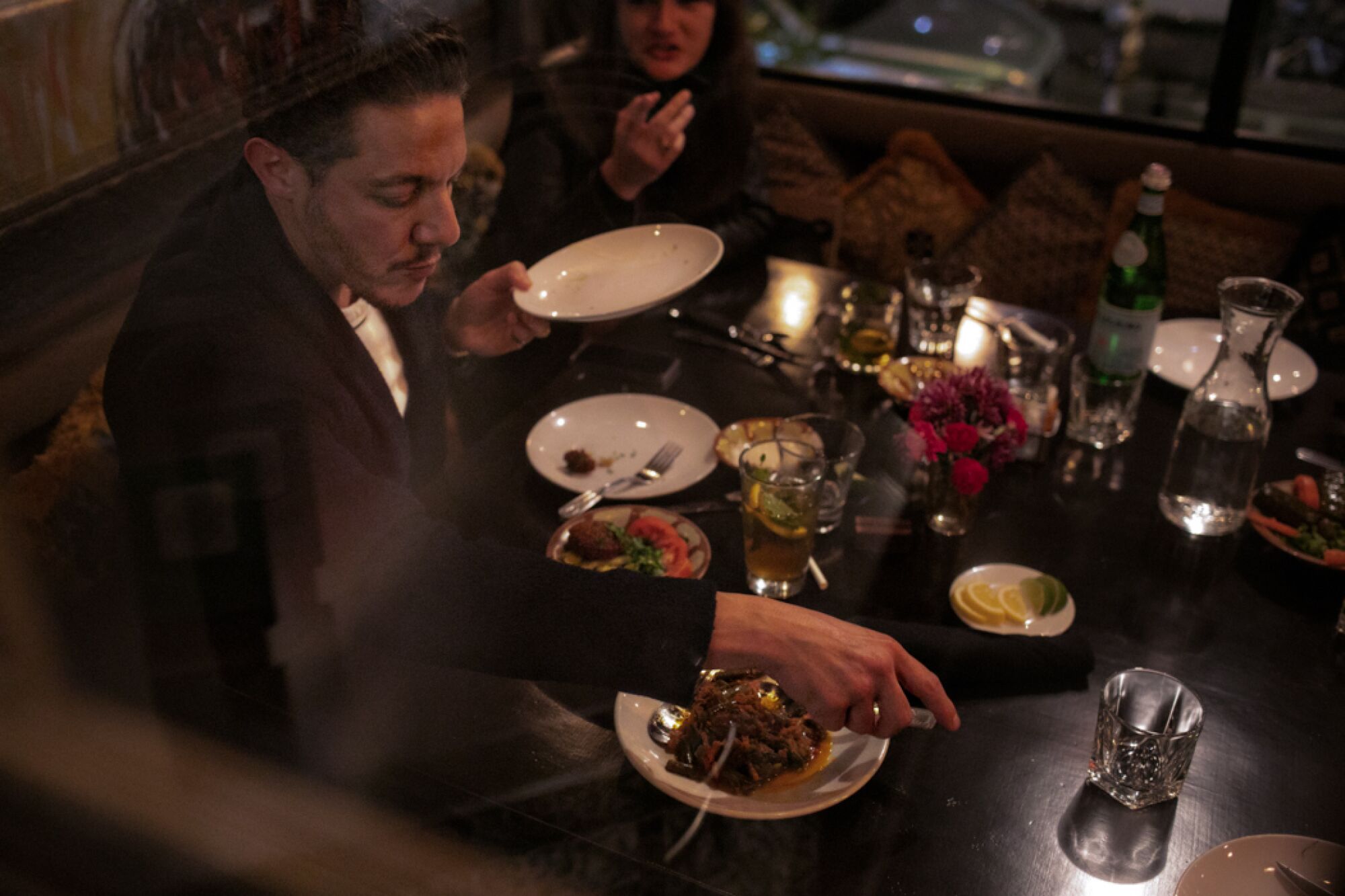 Actor Theo Rossi digs into the appetizers at Open Sesame.