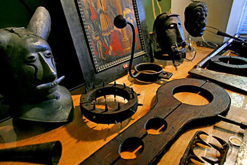 Iron masks are among the items in a collection of torture devices that is up for auction.
