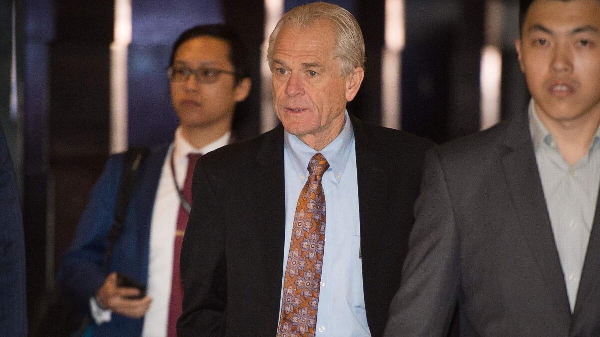 White House economic advisor Peter Navarro, center, walks through a hotel lobby as he heads to the Diaoyutai State Guest House to meet Chinese officials during trade talks in Beijing on May 4.