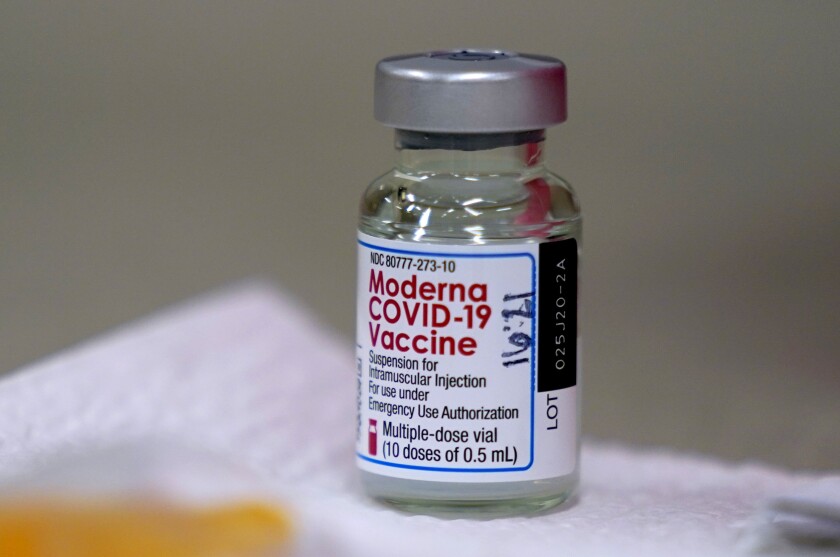 FILE - In this file photo dated Wednesday, Dec. 30, 2020, a bottle of Moderna COVID-19 vaccine on a table before being utilised in Topeka, USA. The European Union’s medicines agency on Wednesday Jan. 6, 2021, gave the green light to Moderna Inc.’s COVID-19 vaccine, a decision that gives the 27-nation bloc a second vaccine to use to fight the virus rampaging across the continent.(AP Photo/Charlie Riedel, FILE)