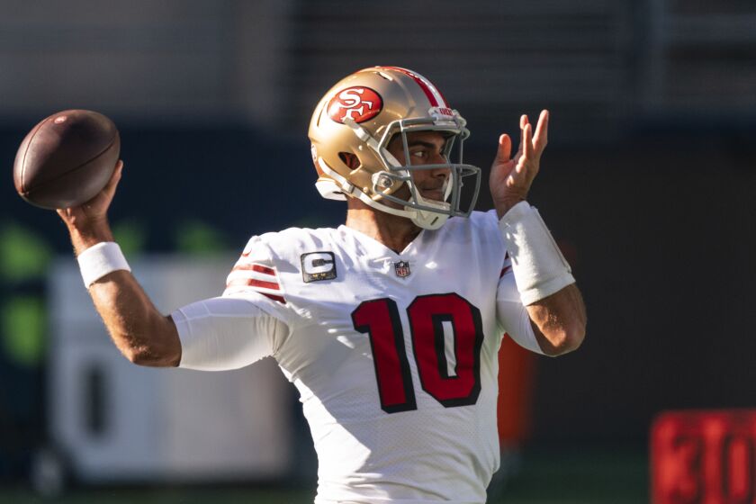 San Francisco 49ers quarterback Jimmy Garoppolo looks to pass during warmups before an NFL football game against the Seattle Seahawks, Sunday, Nov. 1, 2020, in Seattle. The Seahawks won 37-27. (AP Photo/Stephen Brashear)