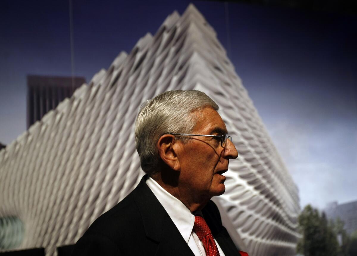 Eli Broad, in profile, against a rendering of the corner of the Broad museum